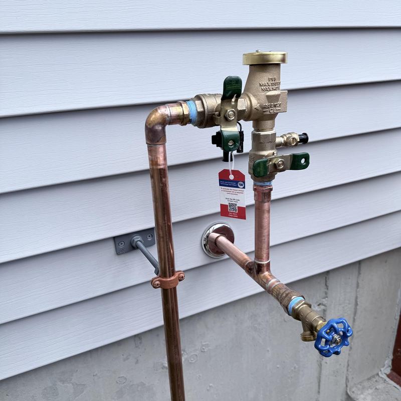 Irrigation backflow preventer and new silcock installation