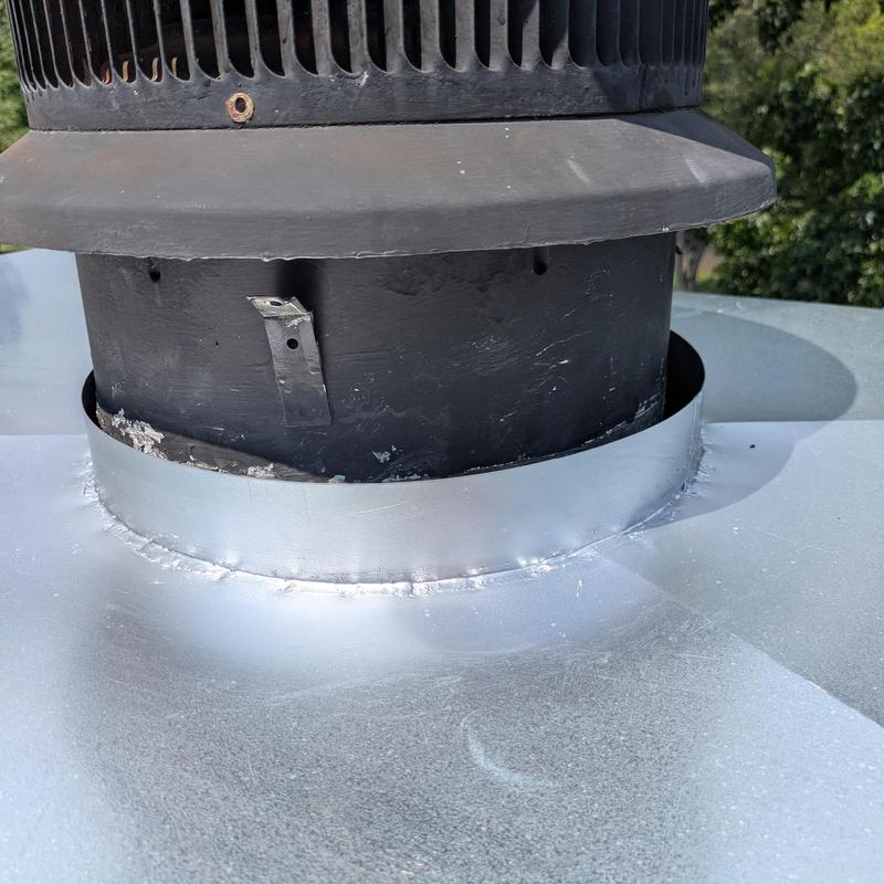 Chimney cap and flashing installation on roof