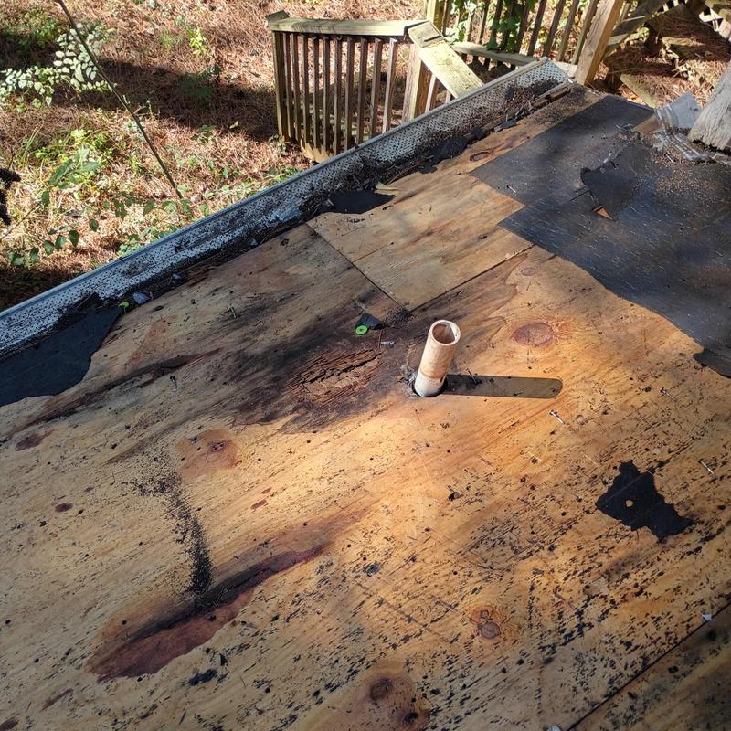 Roof decking with water damage and plumbing vent pipe
