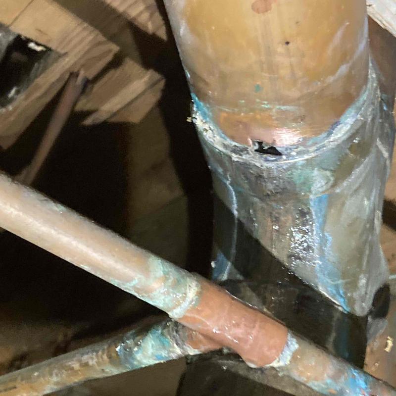 Copper water line with leak in crawl space