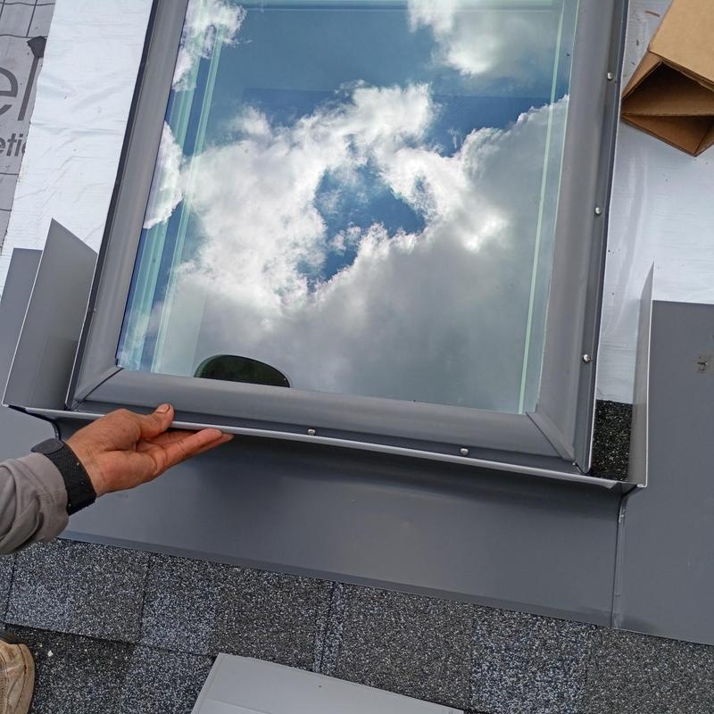 Skylight installation with GAF HDZ shingles on roof