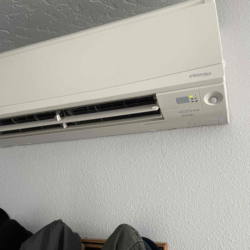 Mini split system indoor unit on wall with controls