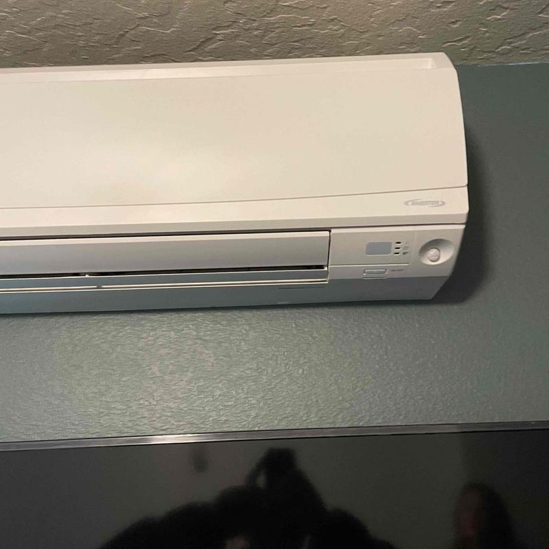 Mini split indoor air handler mounted on wall