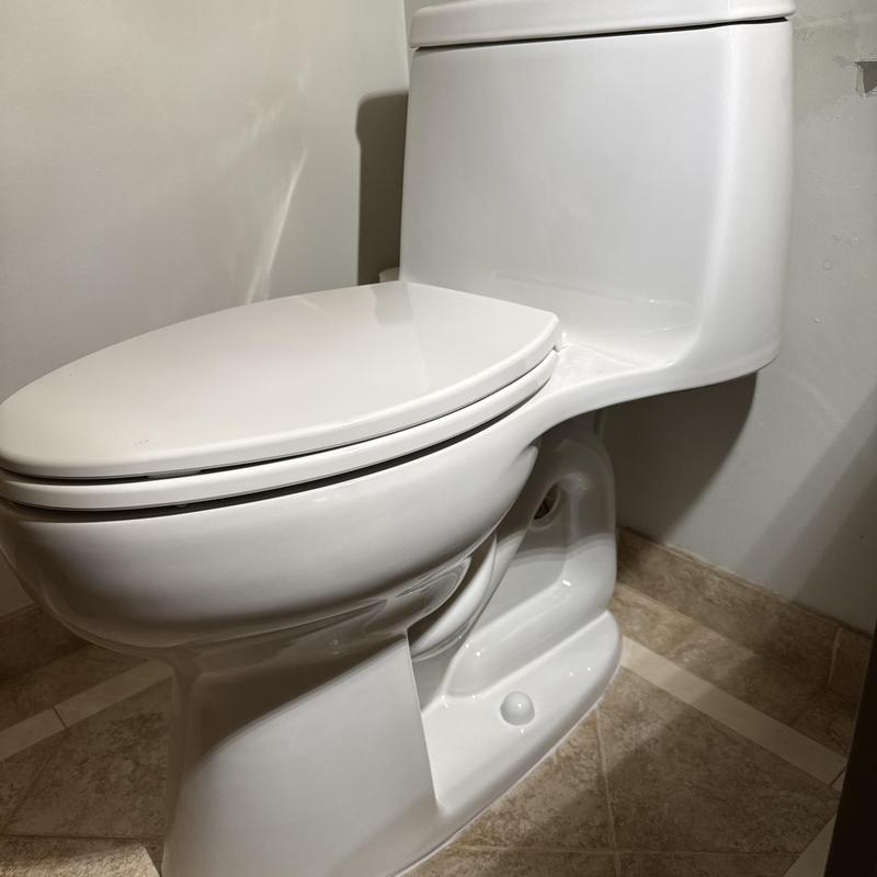 One-piece toilet installation with wax ring and caulking One-piece toilet installation with wax ring and caulking