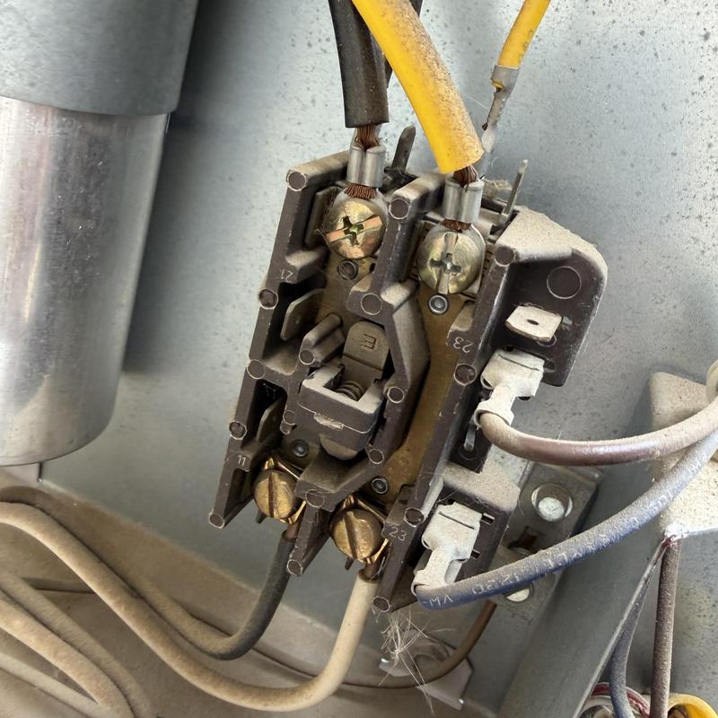 HVAC contactor with wiring and capacitor nearby