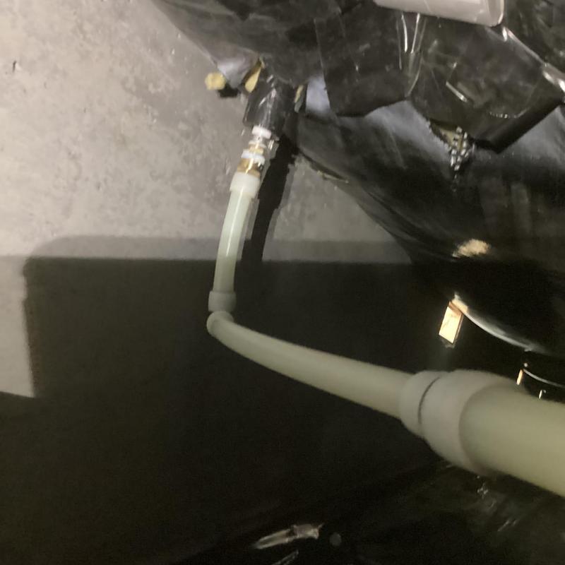 Water service line connection under house with shutoff valve