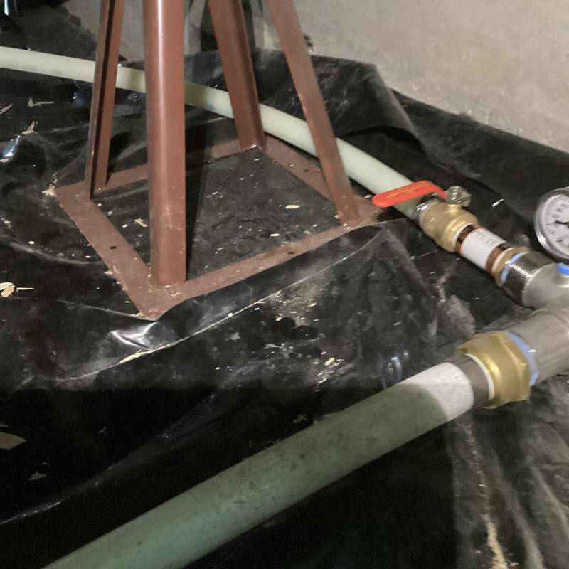 Pressure tank water line with shutoff valve in crawl space