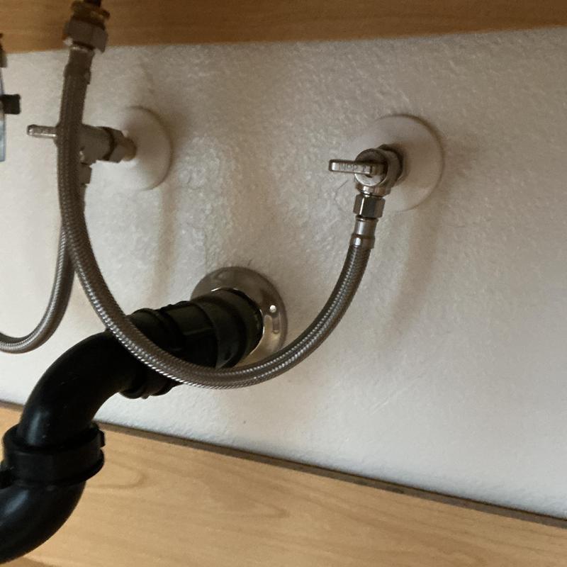 Angle stop valves with flexible water lines under sink Angle stop valves with flexible water lines under sink