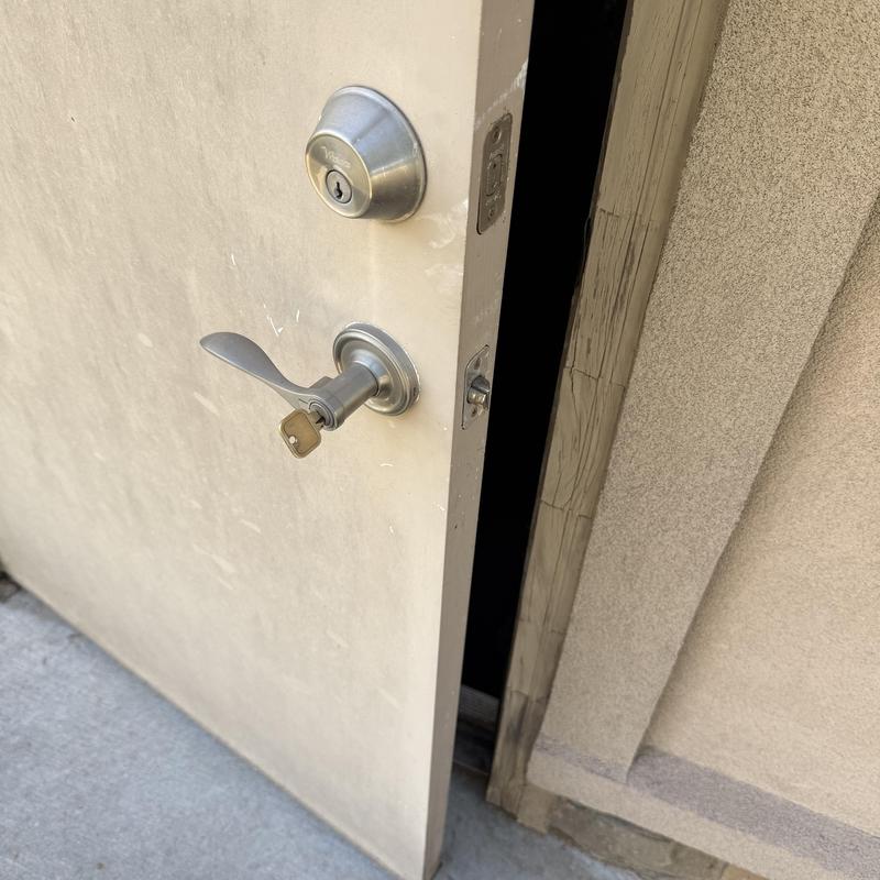 Door lock with key in handle at medical facility entrance Door lock with key in handle at medical facility entrance