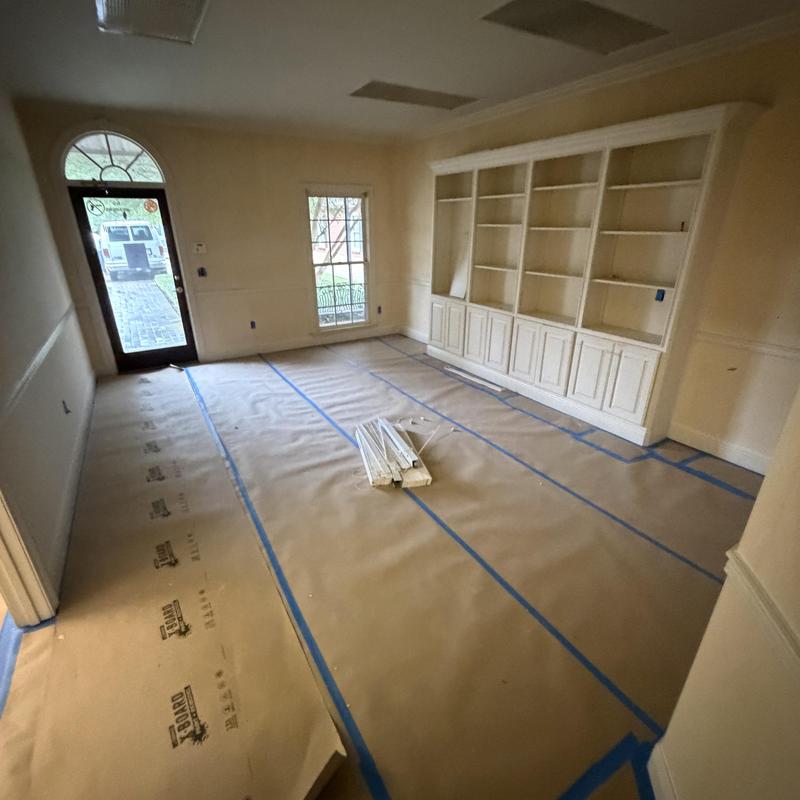 Built-in wall shelves in living room prepped for repainting