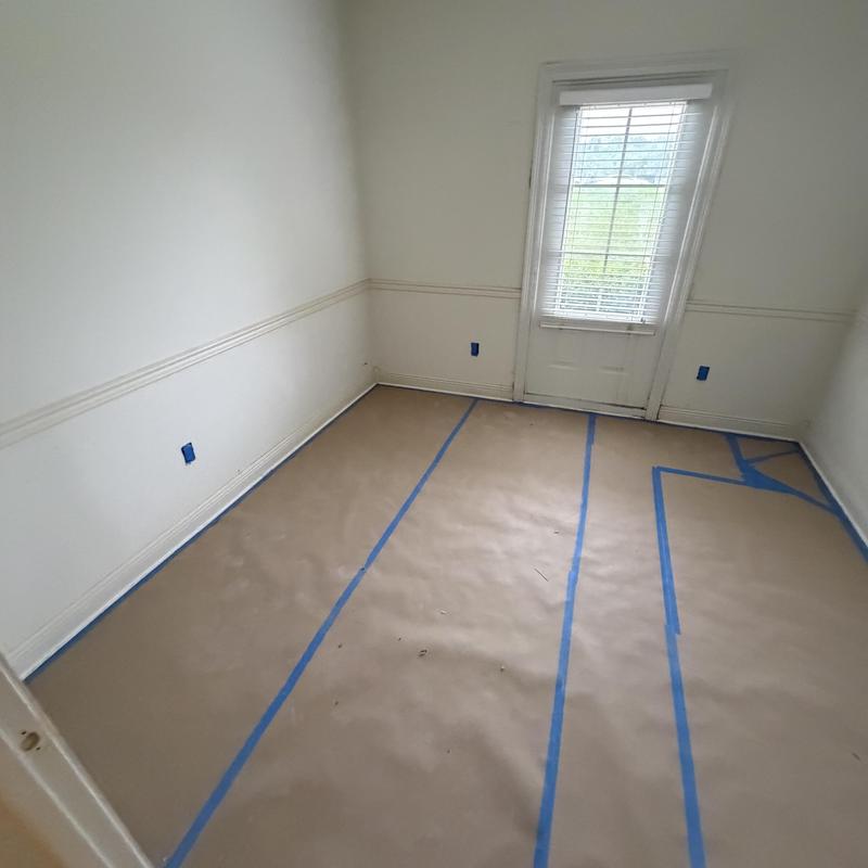 Interior walls with floor protection prep for repainting