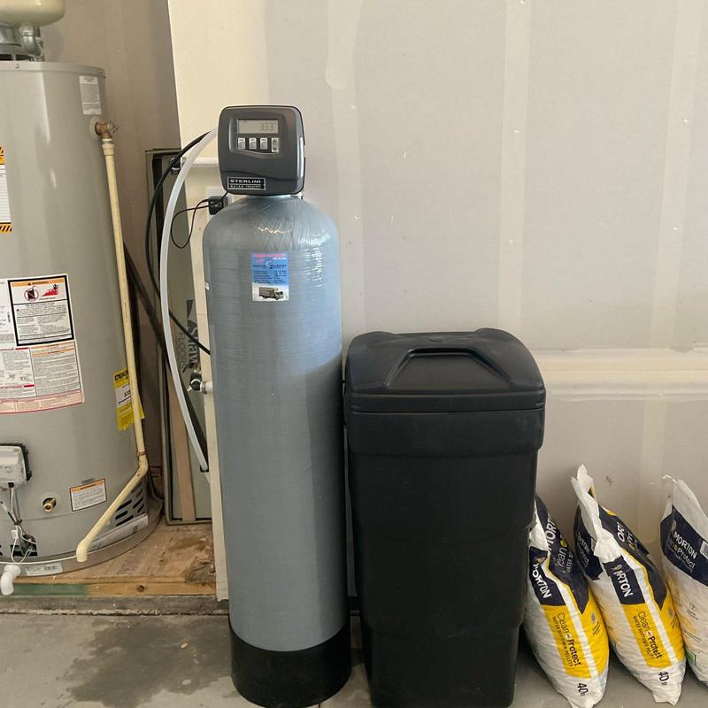Water softener system with brine tank and salt bags
