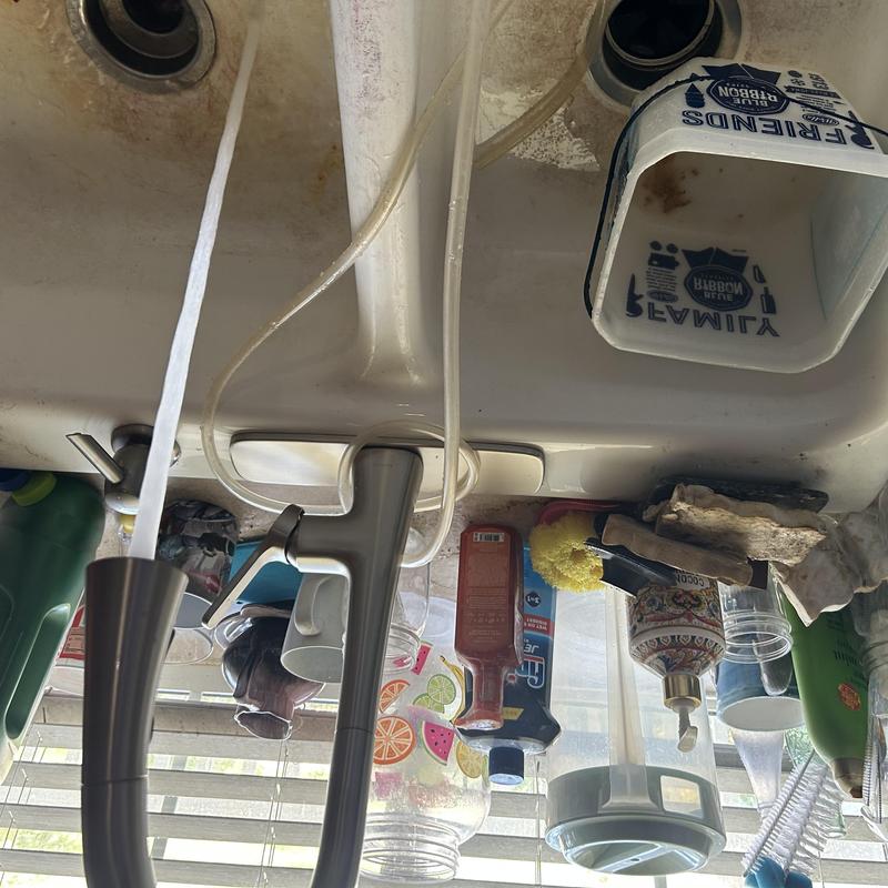 Kitchen faucet and garbage disposal installation under sink