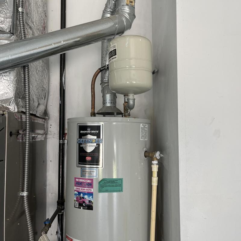 Water heater with pressure tank and vent piping