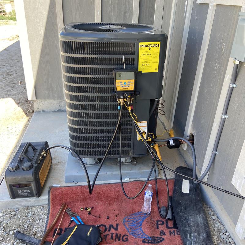 Heat pump with gauges and vacuum pump setup