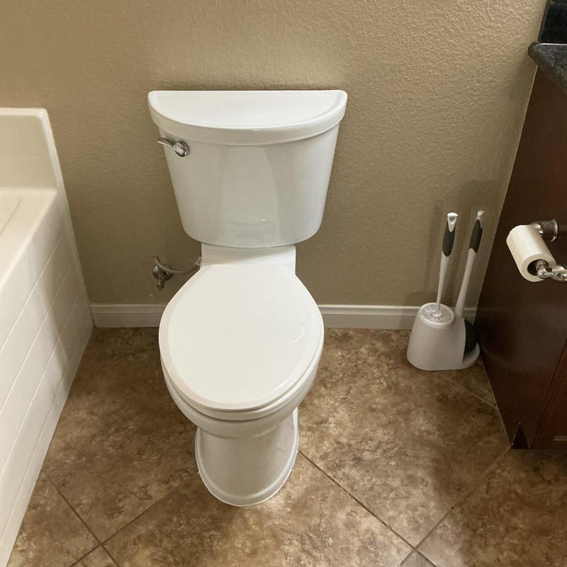 American Standard Champion elongated toilet in bathroom