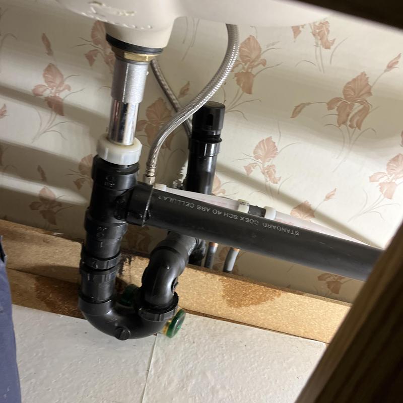 Under-sink drain pipe and P-trap plumbing installation