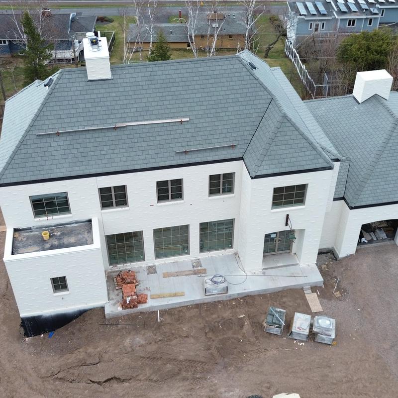 Roof shingles inspection on large residential house