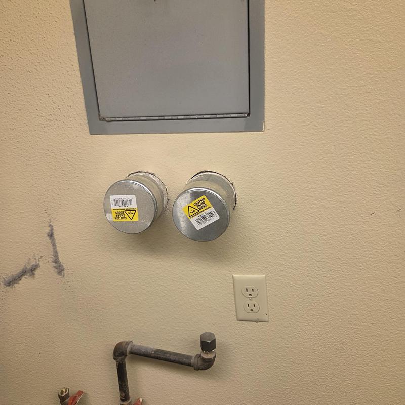 Dryer vent caps and gas line connection in common area