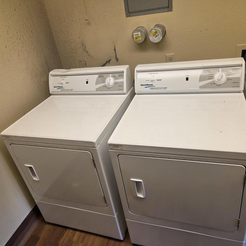 Speed Queen commercial dryers installed in common area