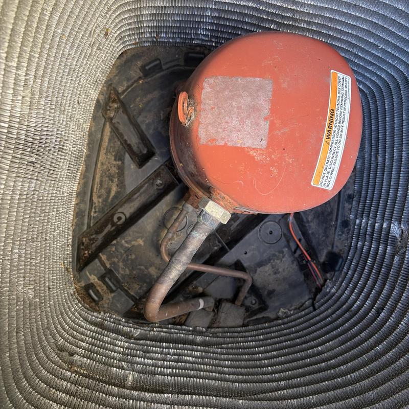 Outdoor HVAC condenser coil with debris buildup
