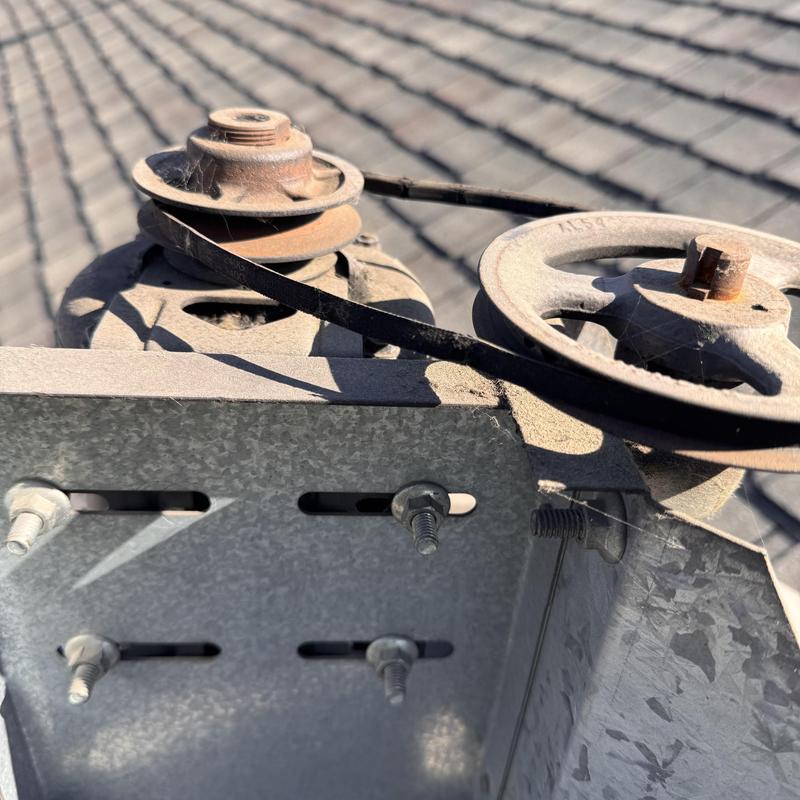 Oven vent pulley system with worn belt and rust