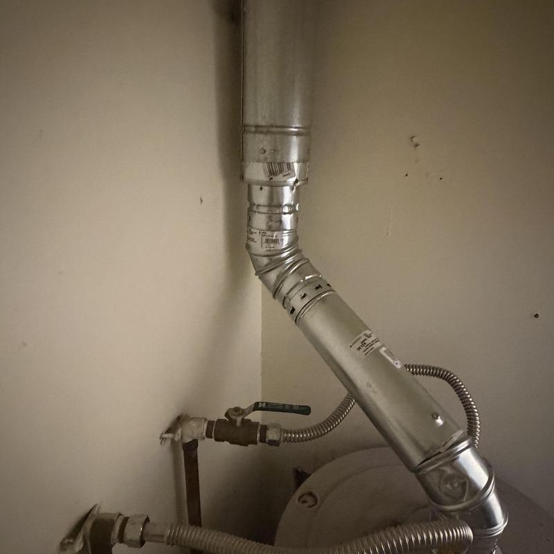 Gas water heater venting and combustion air duct installation
