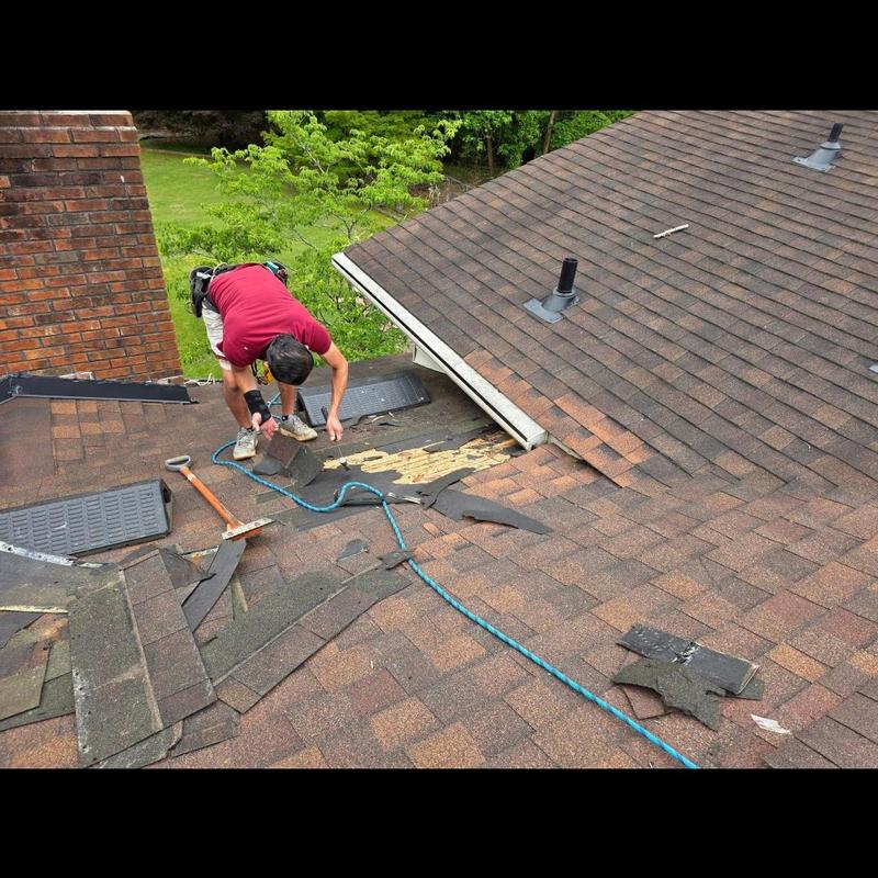 Asphalt shingle roof with storm damage and repairs Asphalt shingle roof with storm damage and repairs