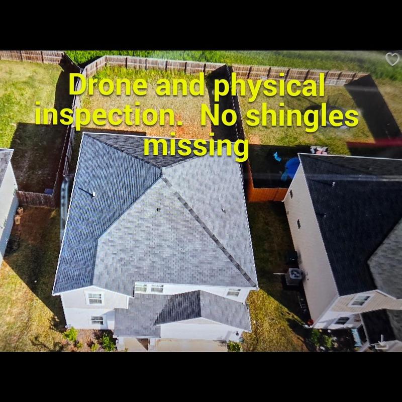 Roof ridge drone inspection showing intact shingles Roof ridge drone inspection showing intact shingles