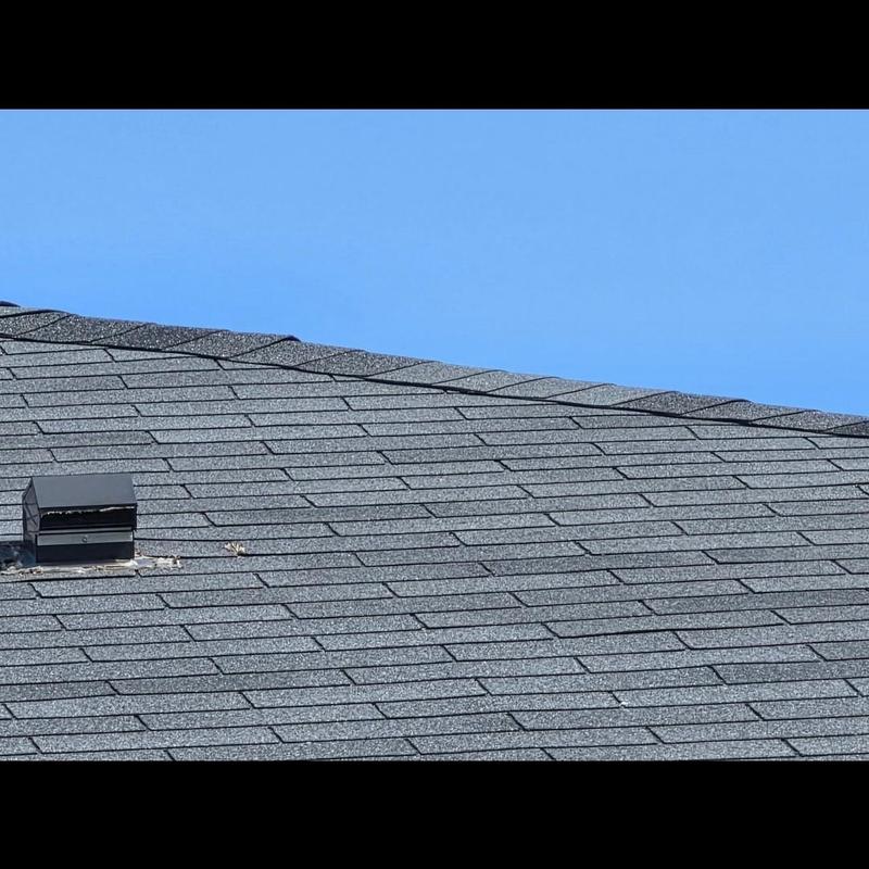 Asphalt shingle roof with vent and minor debris Asphalt shingle roof with vent and minor debris