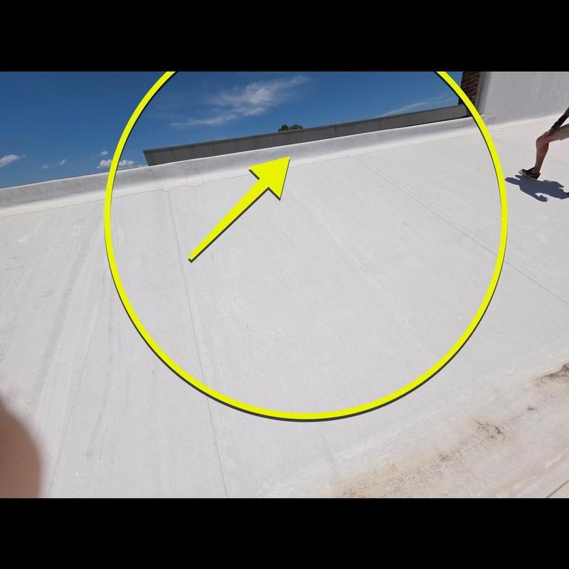 Roof membrane inspection with marked damage area Roof membrane inspection with marked damage area