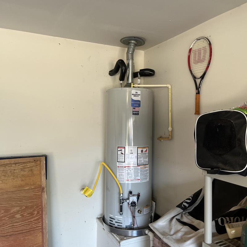 Gas Bradford White water heater installed in utility room