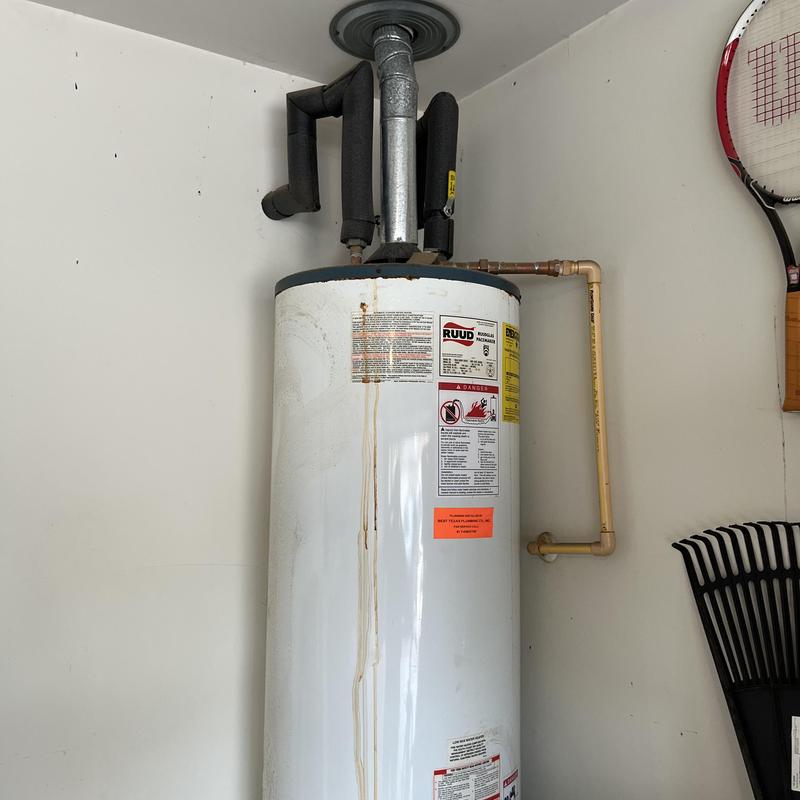 Gas water heater with venting and piping system