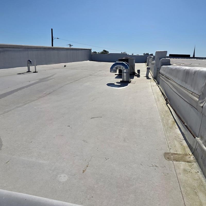 Flat commercial roof with HVAC duct vents