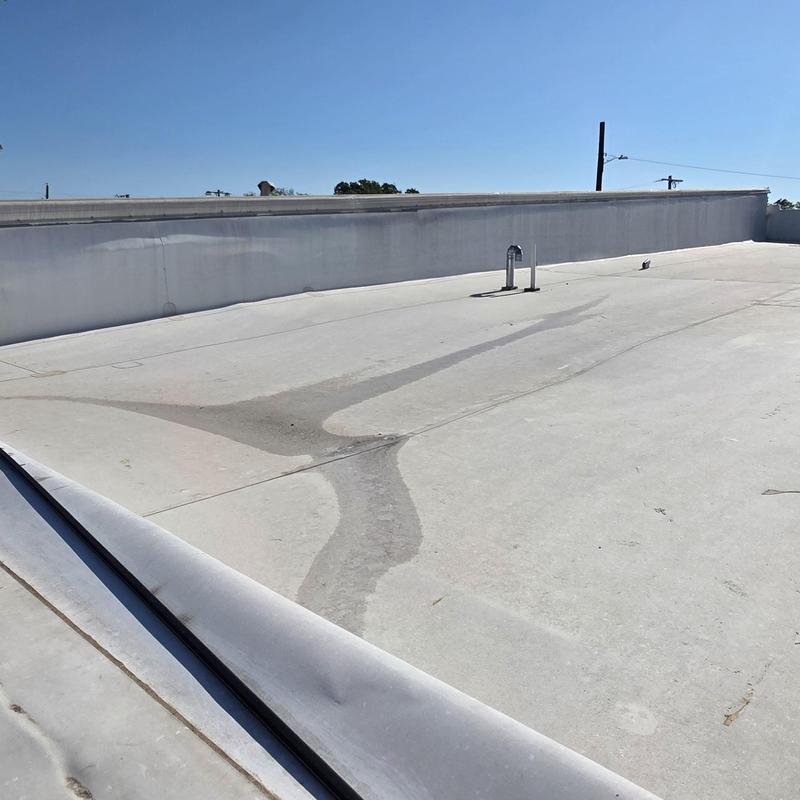 Flat roof membrane with hail damage spotting