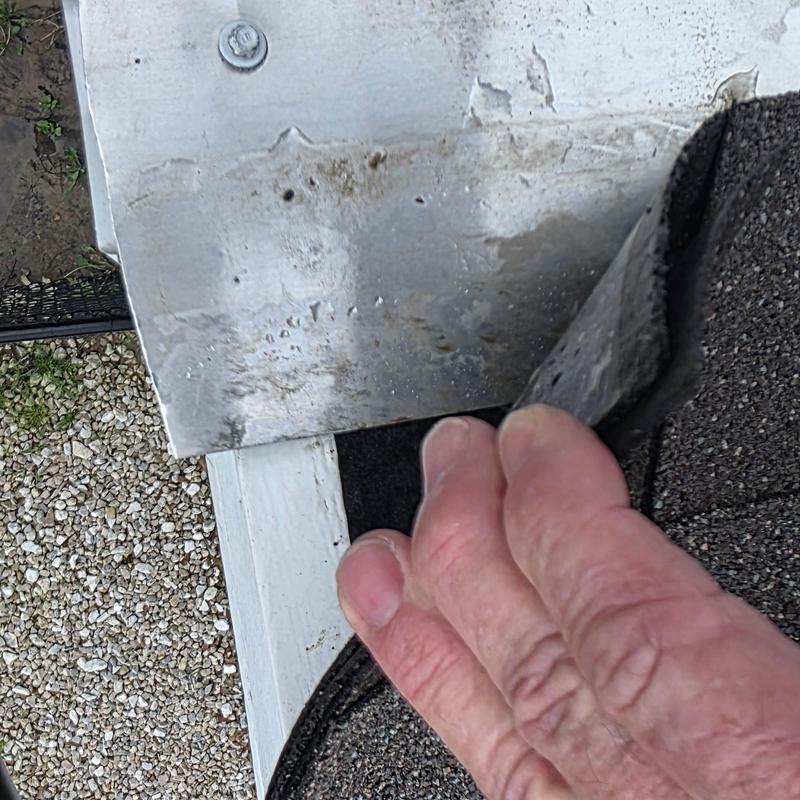 Roof metal flashing with hail damage under shingles