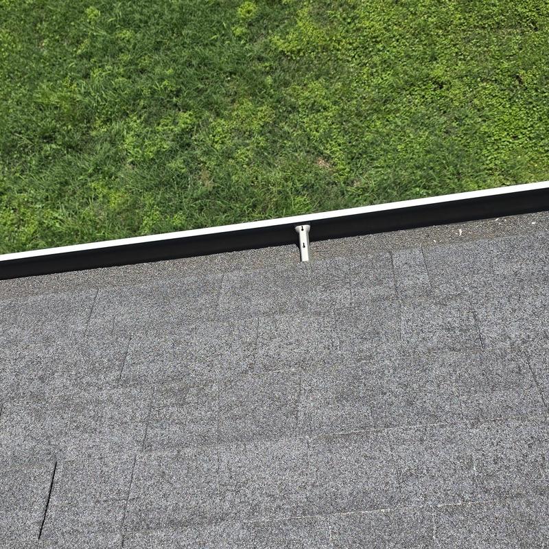 Asphalt shingle roof with hail damage near gutter