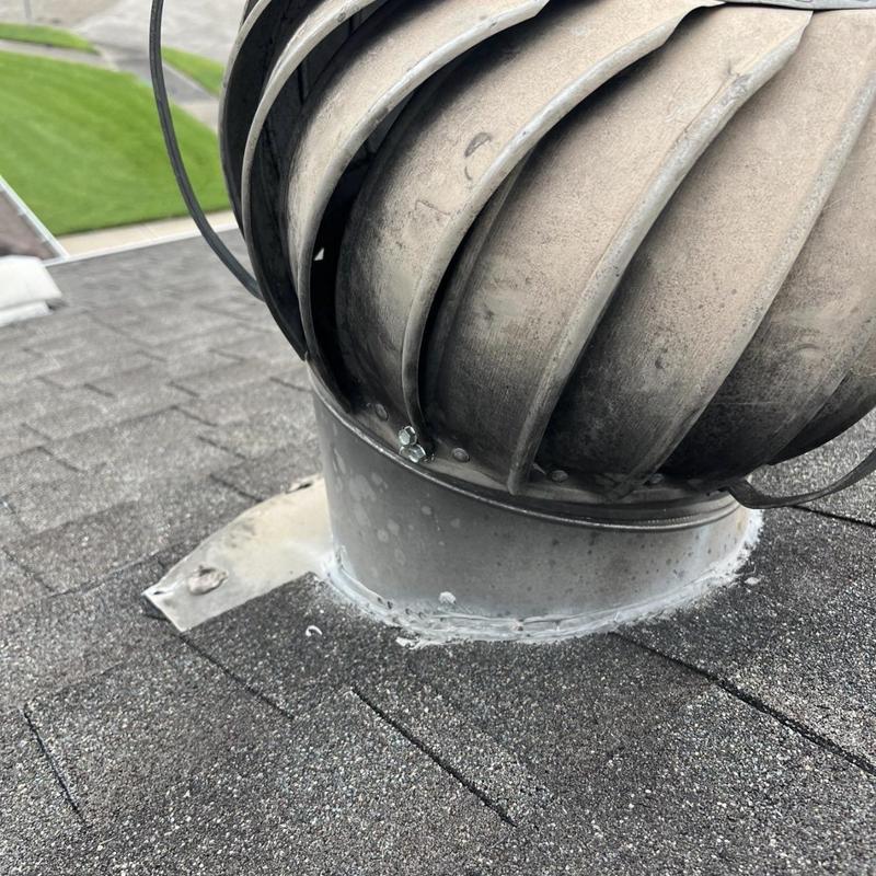 Roof turbine vent with sealed flashing on shingles