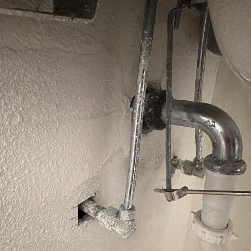 Quarter turn stop valve and drain piping under sink