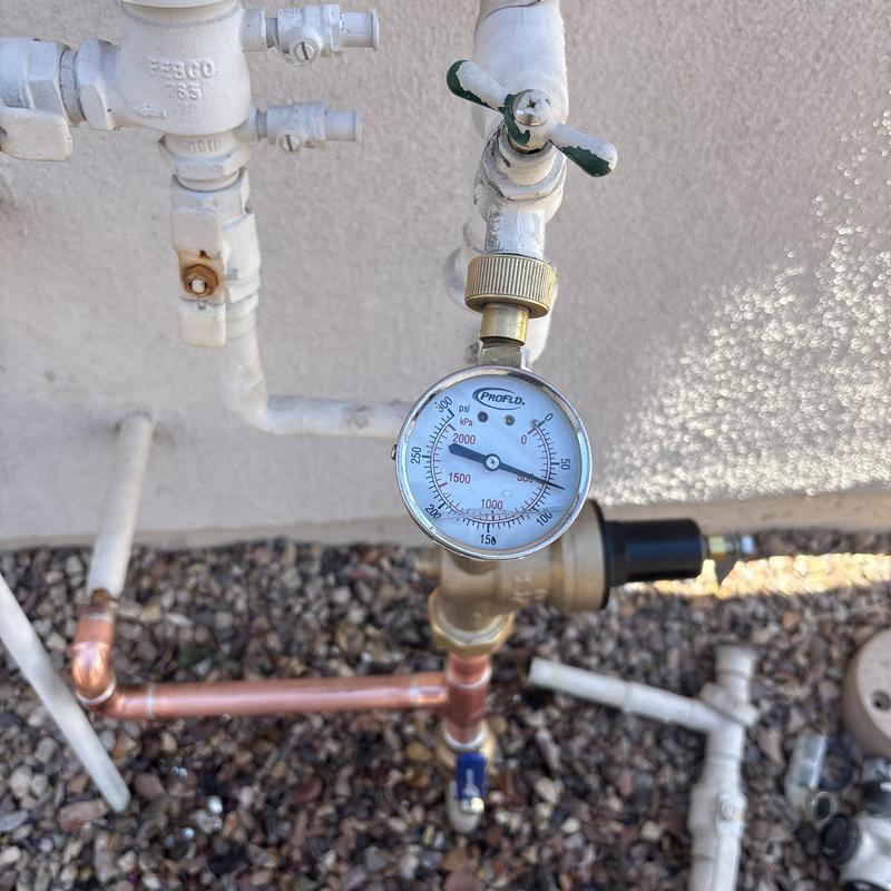 Pressure regulator valve with gauge on copper piping Pressure regulator valve with gauge on copper piping