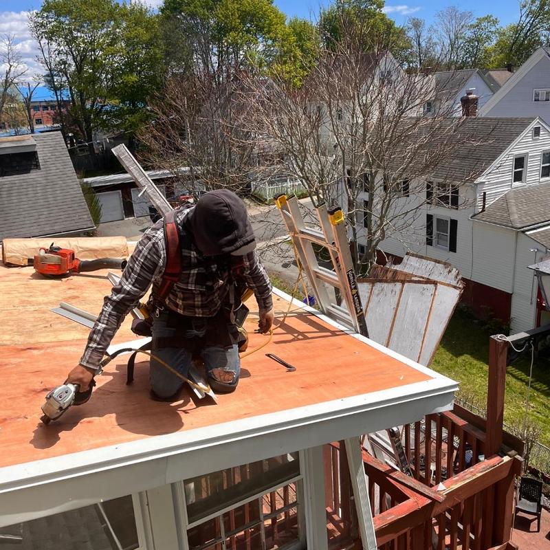 Plywood roof deck installation with safety harness