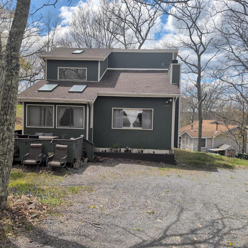 Asphalt shingle roof with skylights inspection outdoors Asphalt shingle roof with skylights inspection outdoors