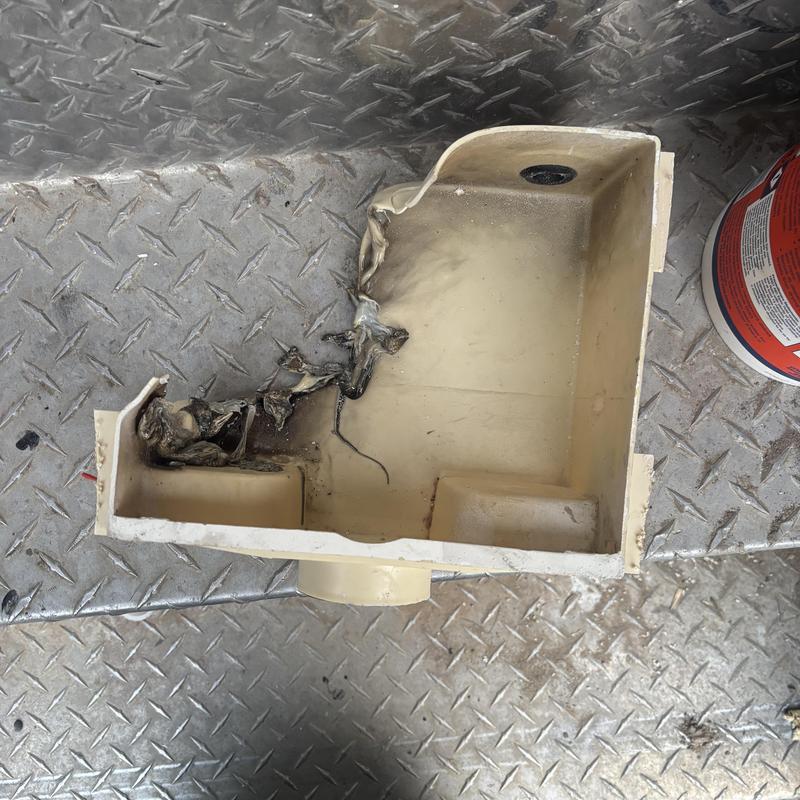Washer box with fire damage and melted plastic