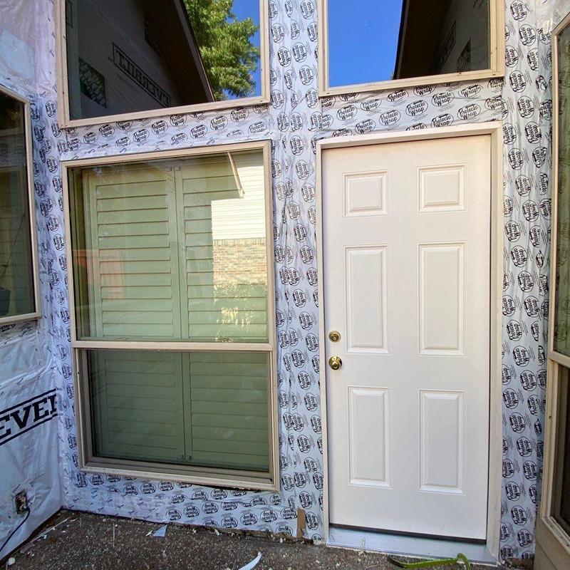 LP SmartSide siding and trim with new back door installation