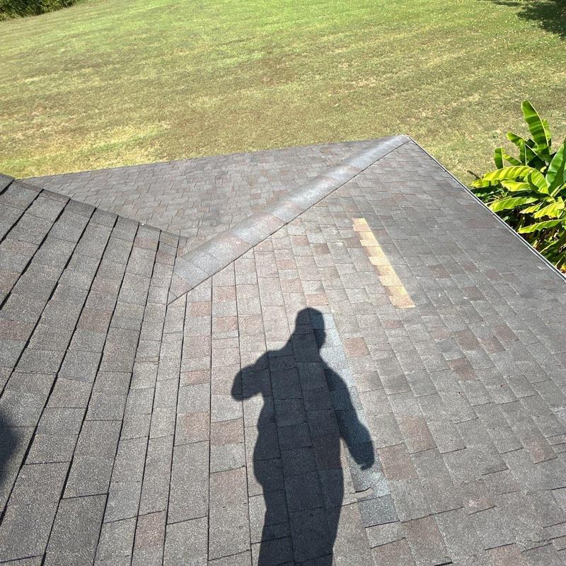 Asphalt shingles with hail damage and sunlit shadow