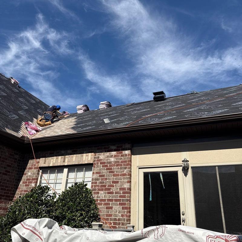 Roof underlayment installation on residential home