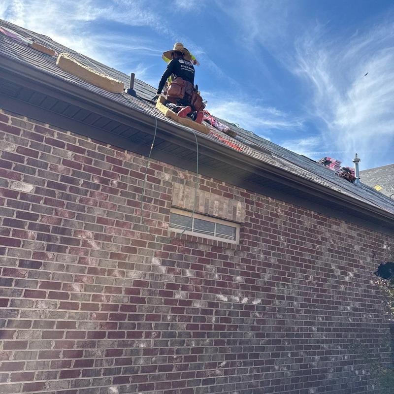 Roof shingles inspection and repair on brick home