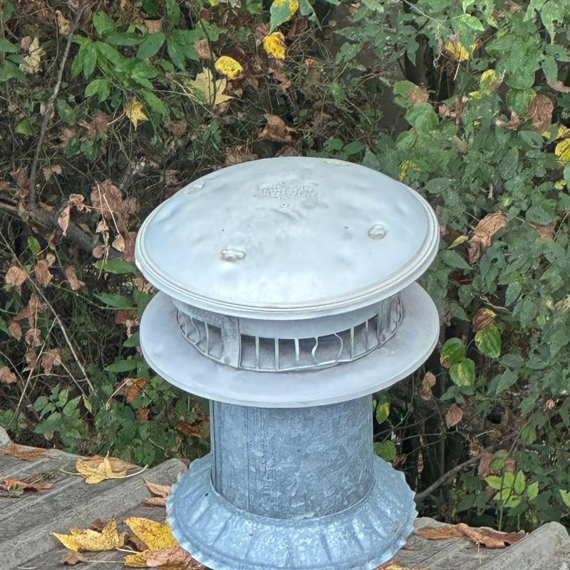 Roof vent pipe cap with rust and dent damage