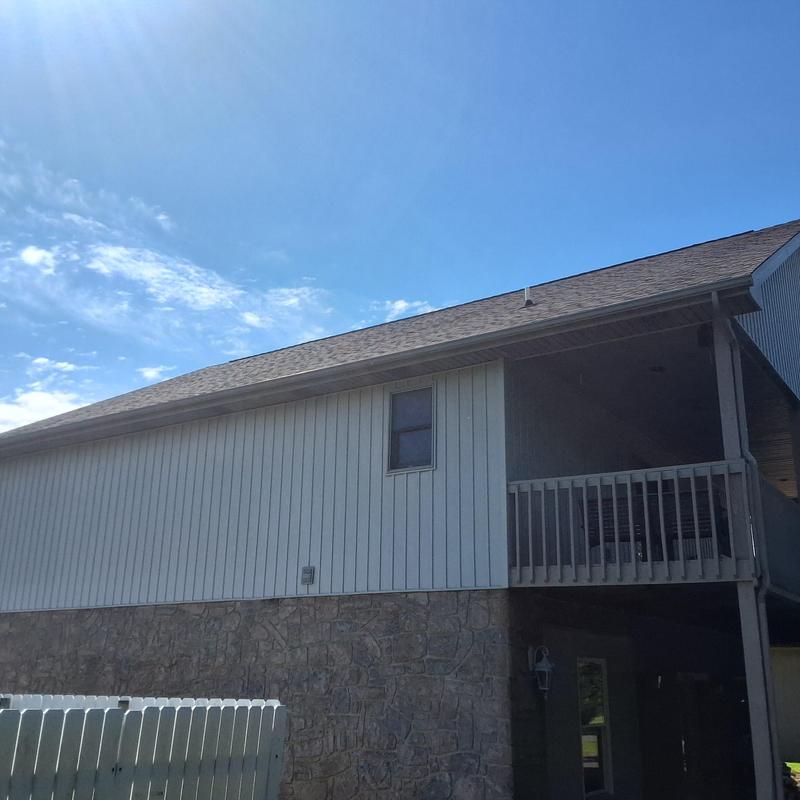 Roof shingles and gutter system on residential home Roof shingles and gutter system on residential home