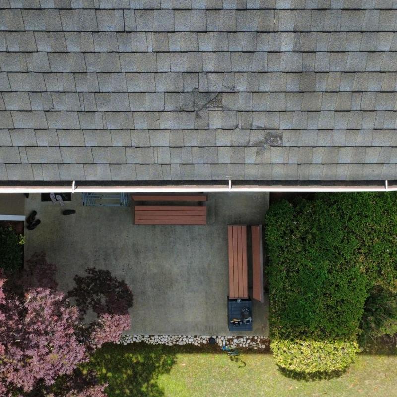 Roof shingles with visible damage and wear